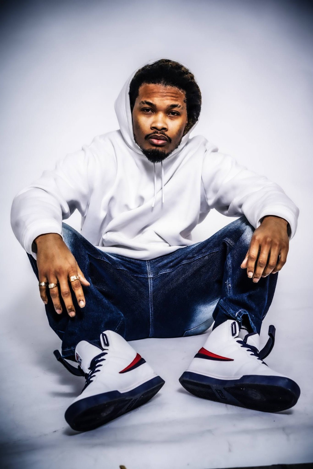Indigo Kirk3 wearing a white hoodie and jeans